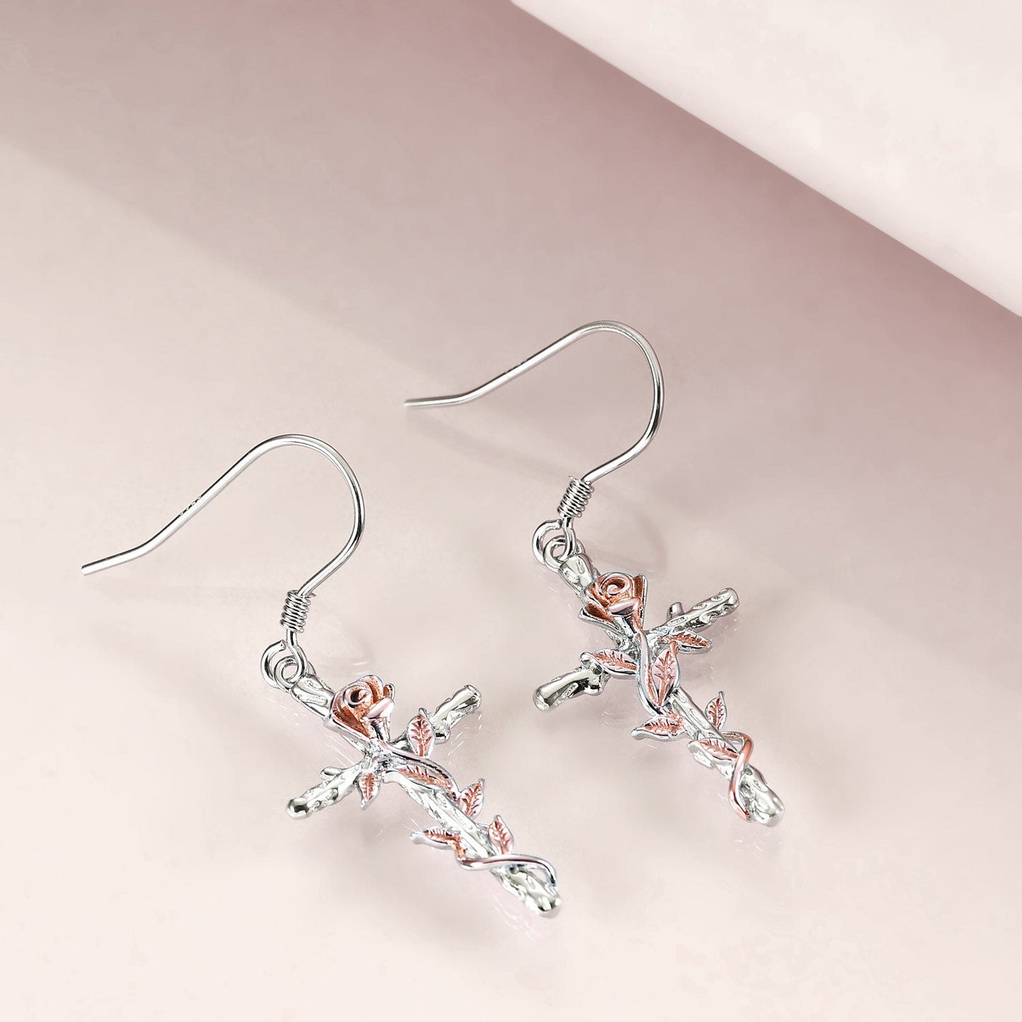 This Sterling Silver Rose Flower Cross  Dangling Earrings Jewelry is perfect for that lovely Christian lady in your life, to show her how much you care. The exquisite sterling silver design and intricate features makes these earring a special gift for Christmas, birthday, anniversary, Mother's Day or any occasion that you what to show her how much you enjoy her in your life.  Spoil yourself and get you a set of these earrings too, you deserve it.